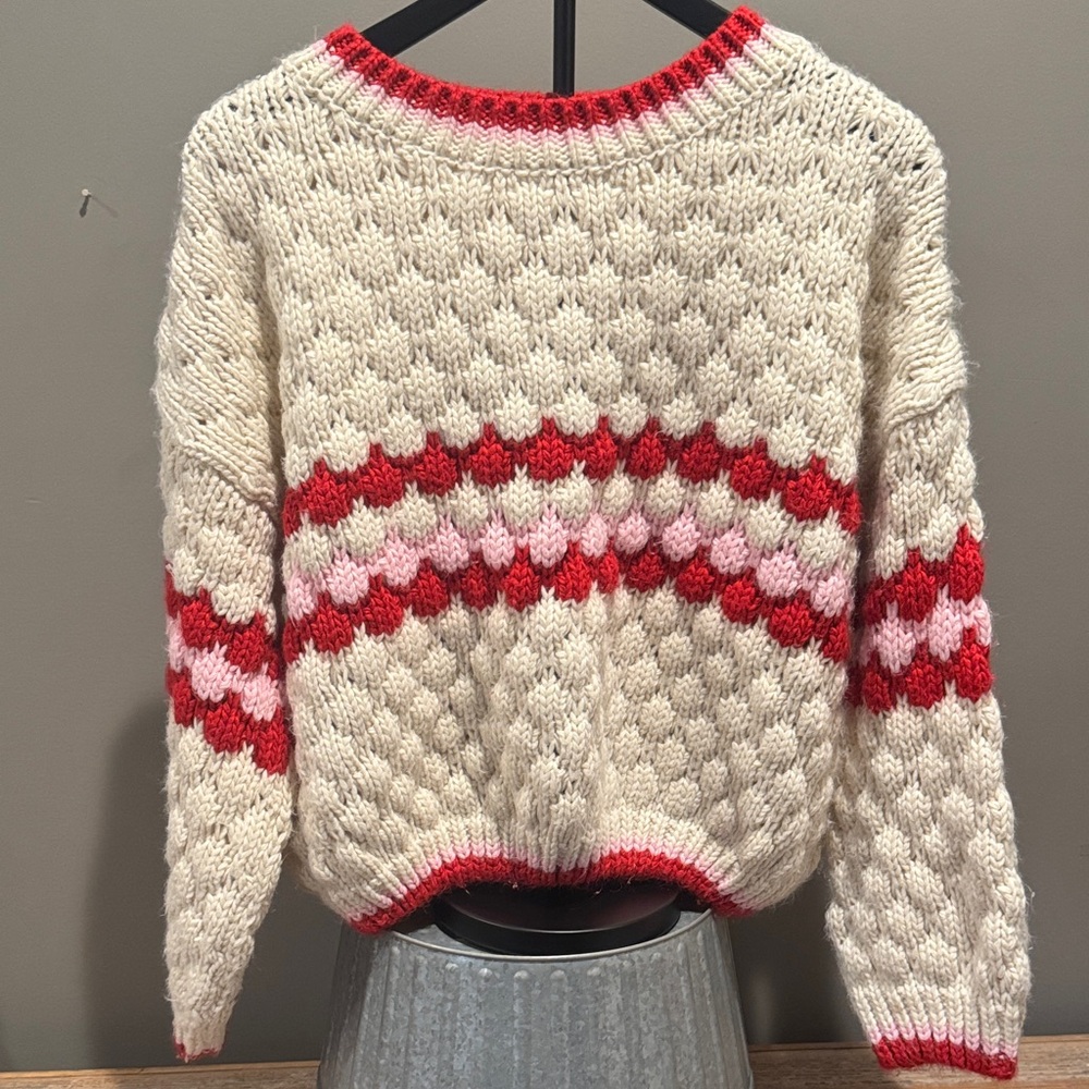 Cozy Knit Sweater with Red and Pink Accents